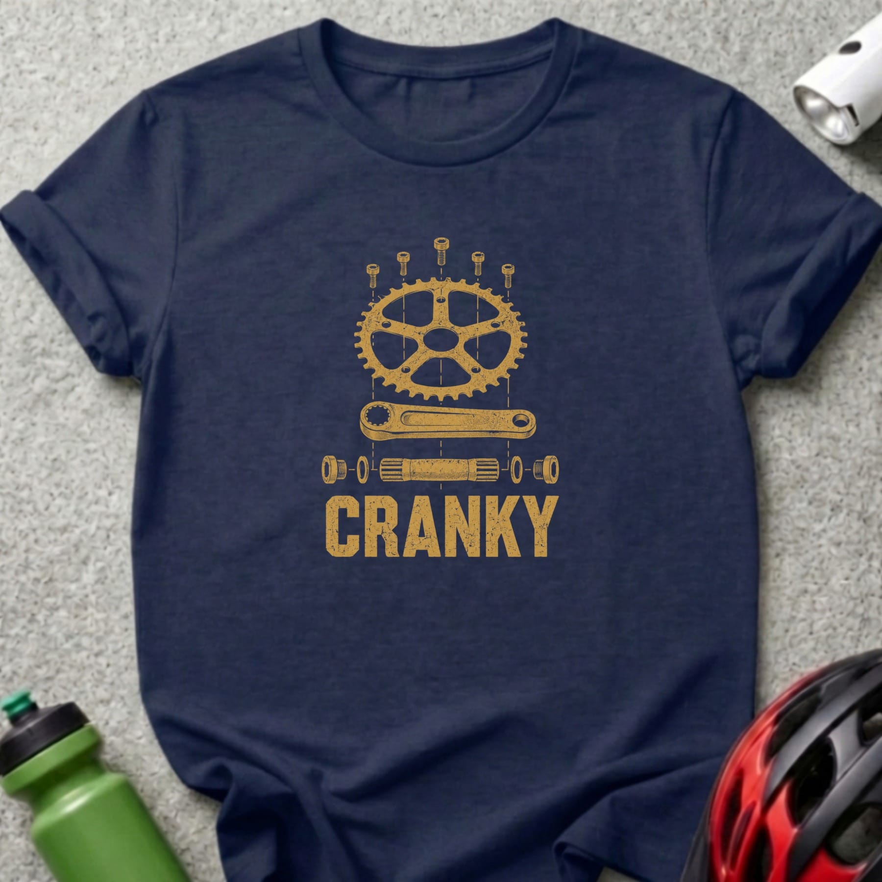 Dark blue t-shirt with distressed gold graphic of bicycle crankset parts and the word "CRANKY".