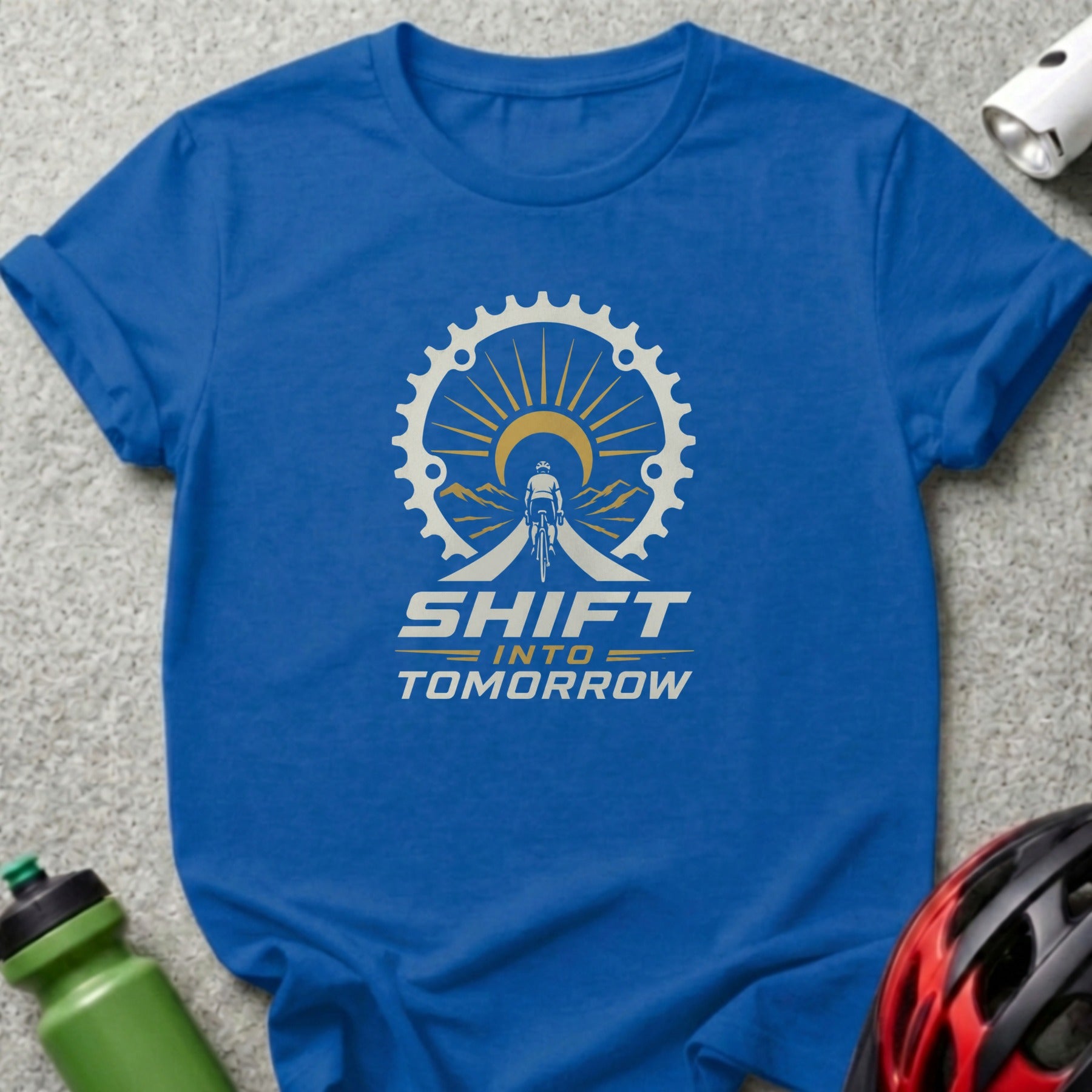Blue t-shirt with graphic reading "SHIFT INTO TOMORROW" and a cyclist silhouette.