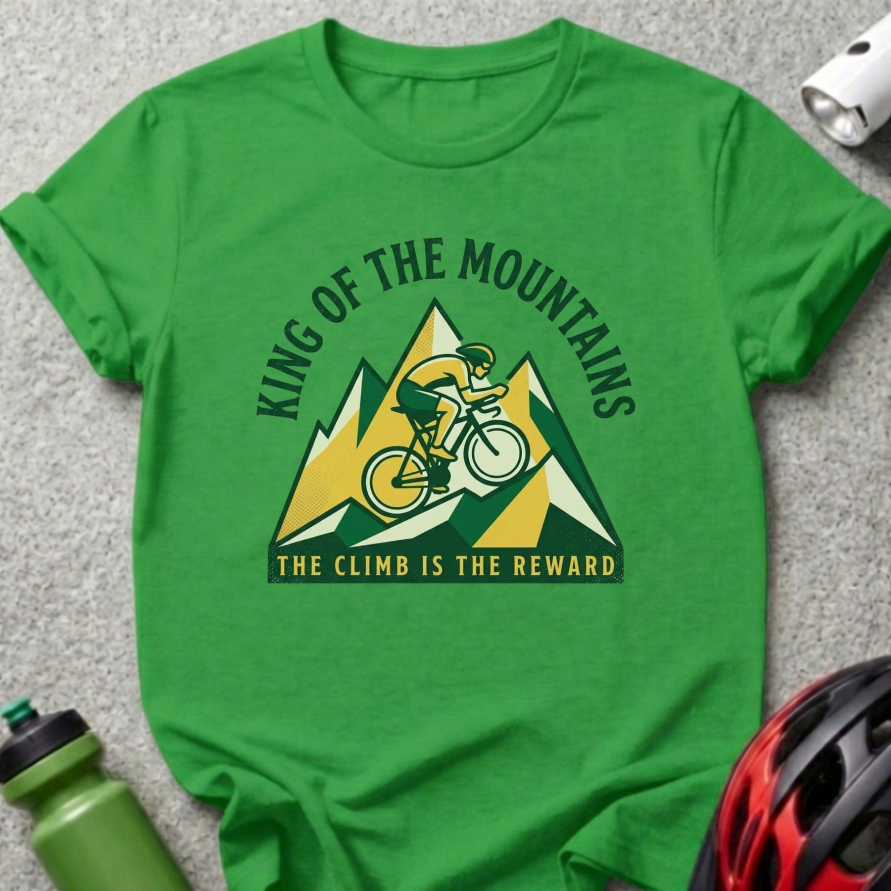 Green t-shirt with cyclist on mountain graphic, "King of the Mountains" text.