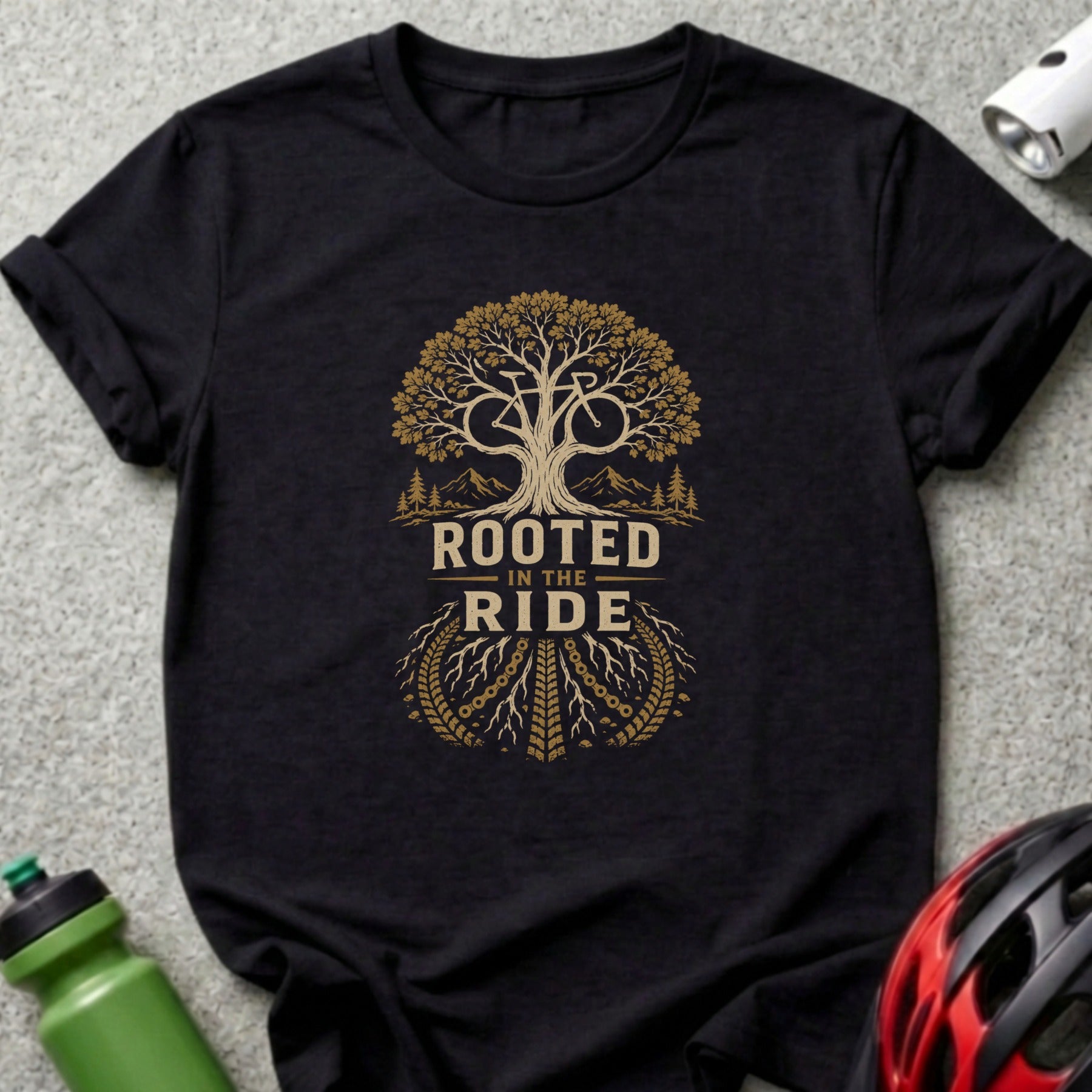Black t-shirt with "ROOTED IN THE RIDE" text and a bicycle tree graphic.