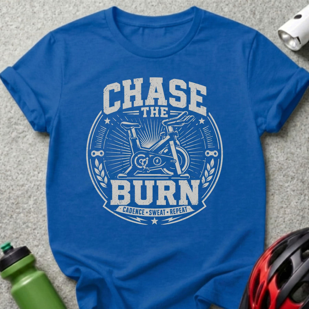 Royal blue t-shirt with "Chase the Burn Cadence Sweat Repeat" text and stationary bike graphic.