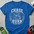 Royal blue t-shirt with "Chase the Burn Cadence Sweat Repeat" text and stationary bike graphic.