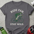 Cyclist wearing green jersey rides bicycle, "Ride Far. Stay Wild." text.