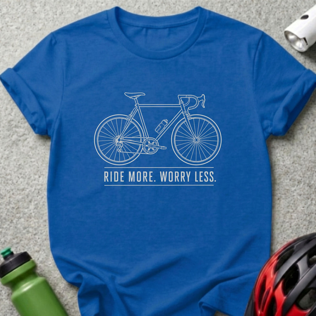 Blue t-shirt with white outline of a bicycle and text "RIDE MORE. WORRY LESS."