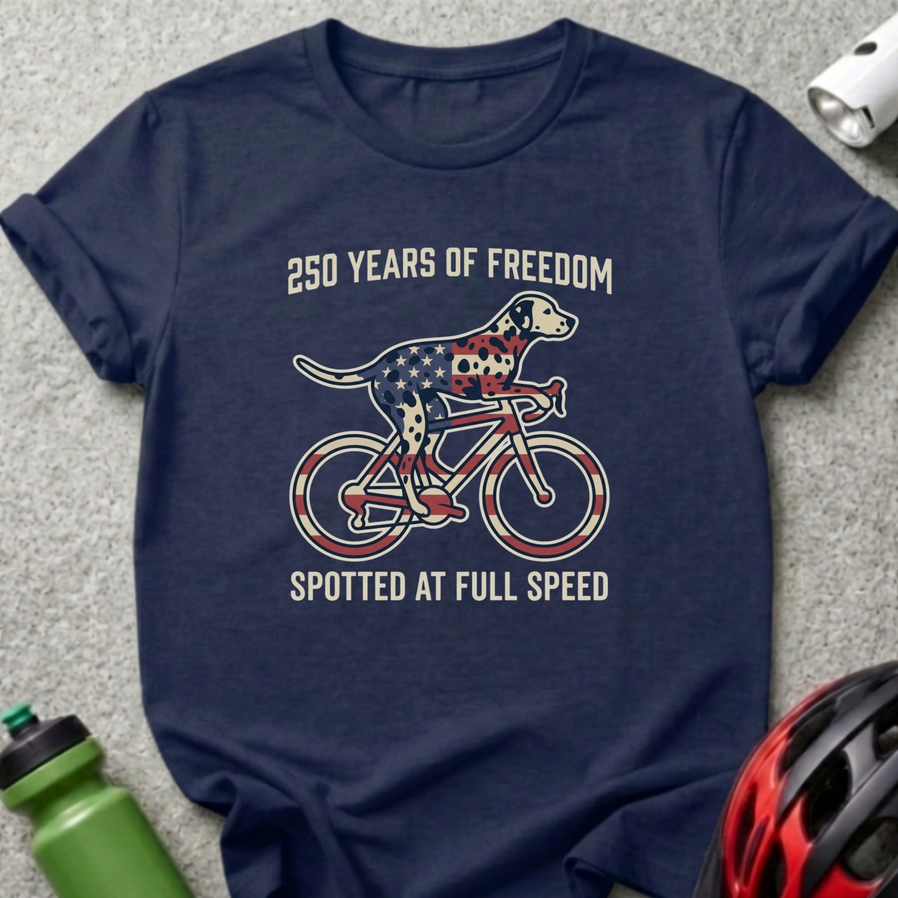 Dalmatian riding a bicycle with American flag pattern, "250 Years of Freedom" text.