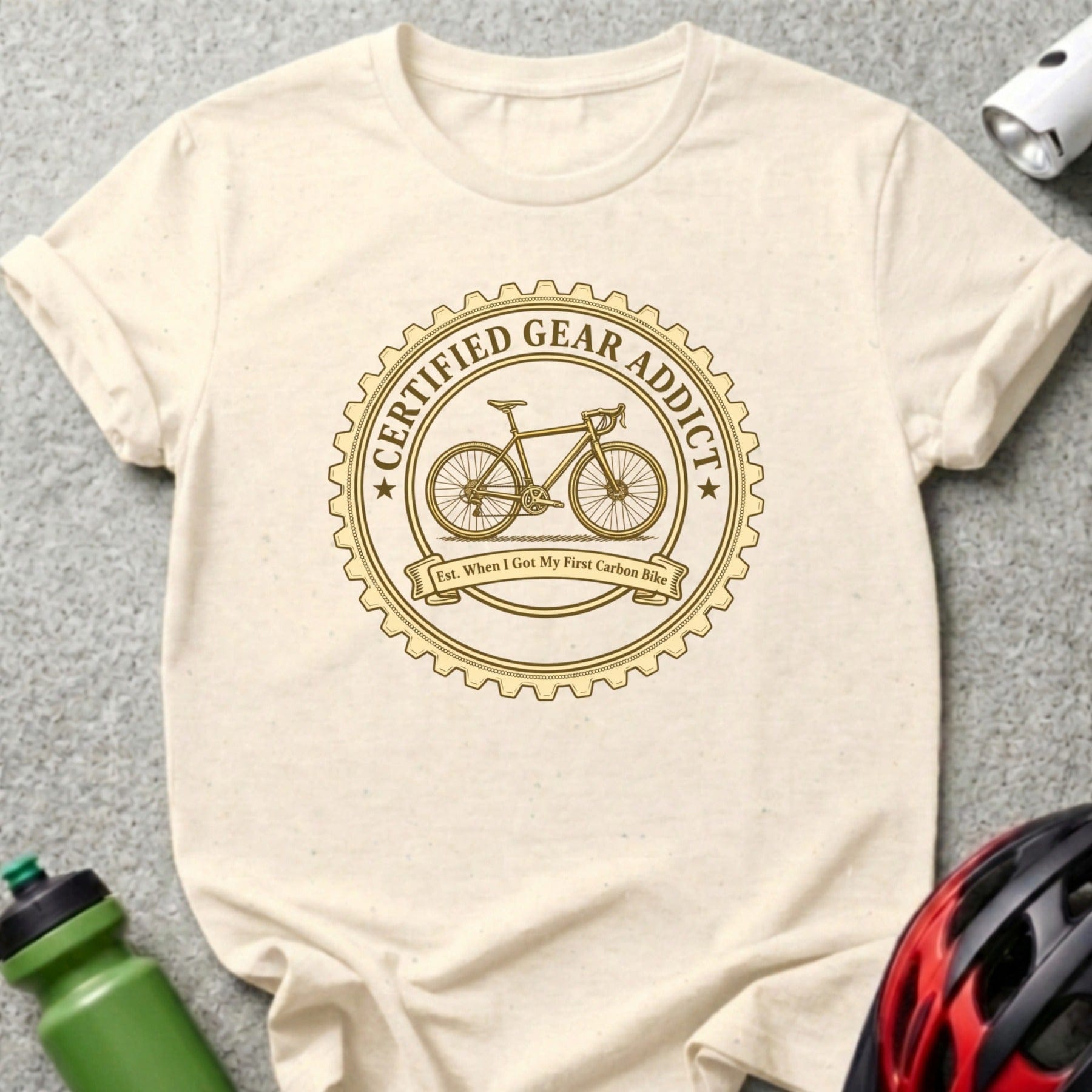 Cream t-shirt with "Certified Gear Addict" circular logo and bicycle graphic.