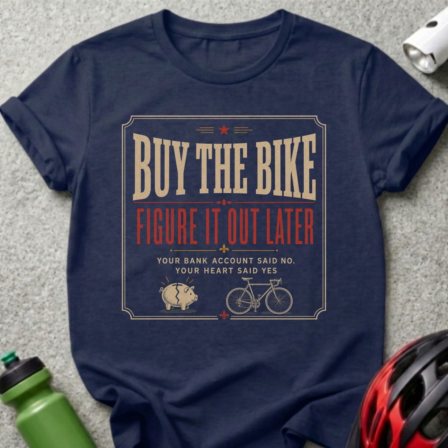 T-shirt with text "Buy the bike, figure it out later" and a piggy bank.