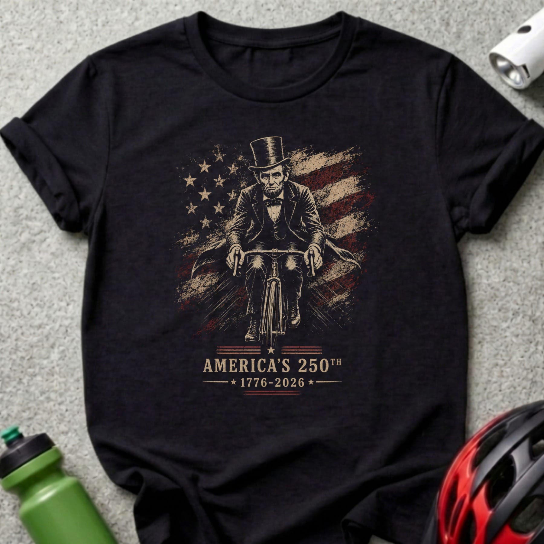 Abraham Lincoln on a bicycle with American flag and "America's 250th 1776-2026" text.