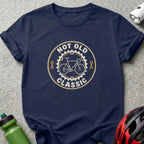 Navy blue t-shirt featuring a circular graphic with a bicycle, gears, and the text NOT OLD CLASSIC.