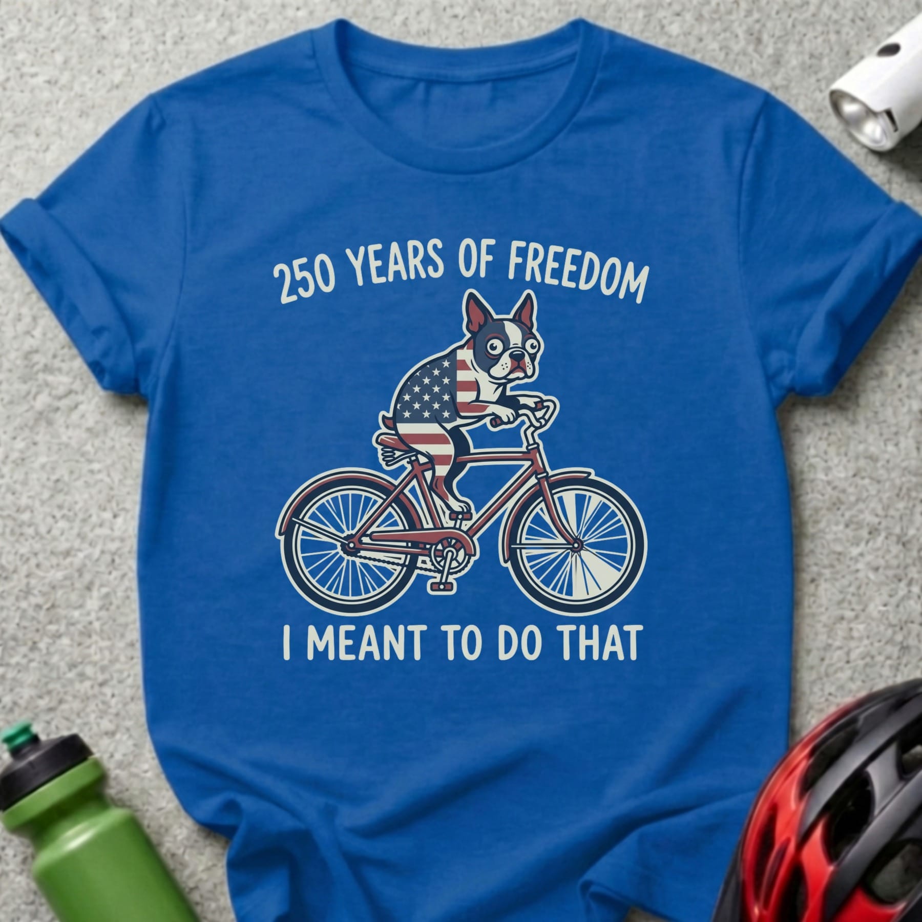 Blue t-shirt with a bulldog on a bike, "250 Years of Freedom" and "I Meant to Do That."