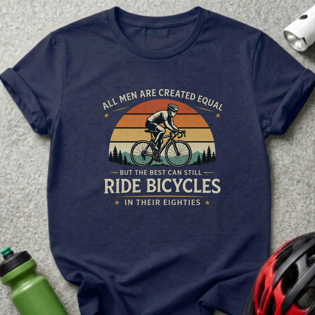 Navy t-shirt with graphic "All men are created equal but the best can still ride bicycles in their eighties".