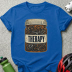 Pill bottle filled with bicycles, labeled "THERAPY" with Rx symbols.