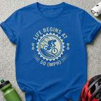 Blue t-shirt with "Life Begins at 50 (MPH)" graphic and cyclist silhouette.