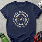 Navy t-shirt with circular graphic saying "Not slower, just more efficient" and a speedometer.