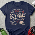 T-shirt with "Your bank account said no, your heart said yes, buy the bike" text.